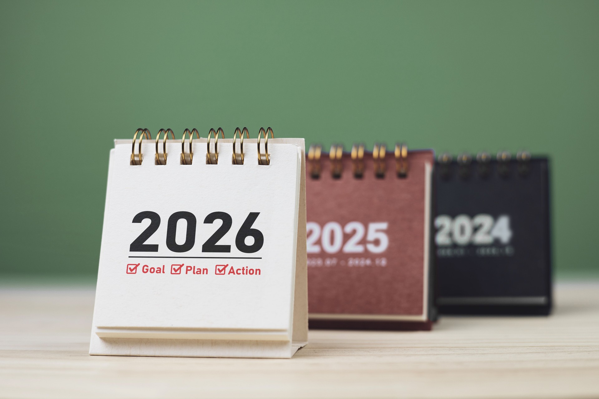 Calendar page of 2026, white on wooden table. Concepts of planning for success Calendar page of 2026, white on wooden table. Concepts of planning for success